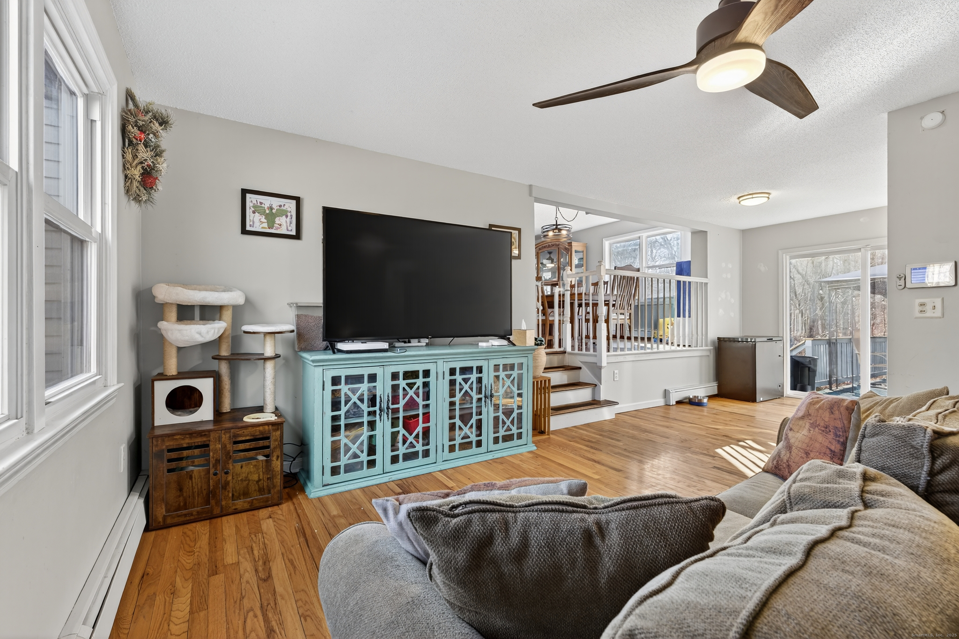 116 Spicer Hill Road Ledyard, CT 06339 - Photo 6 of 29 a living room with furniture and a flat screen tv