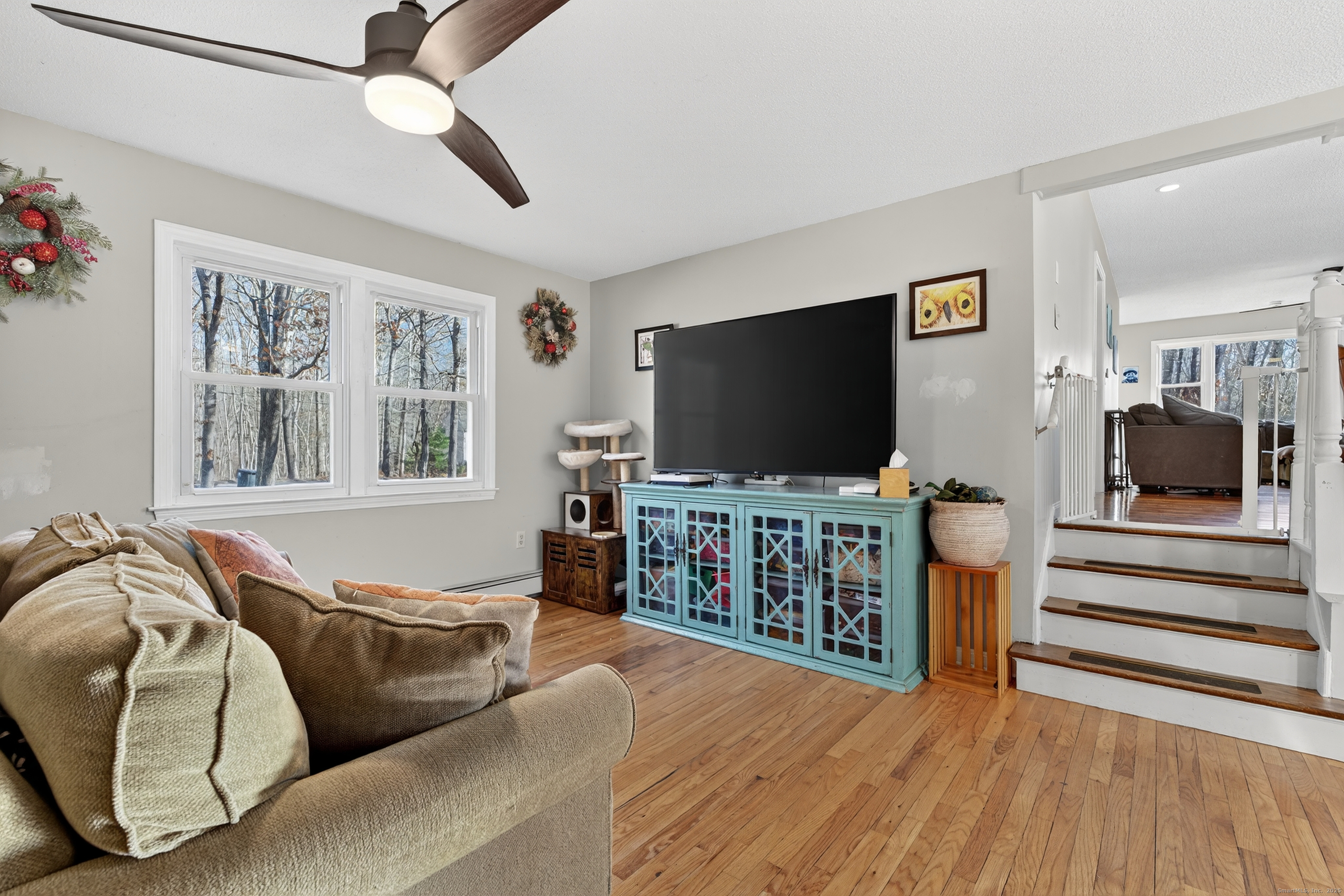 116 Spicer Hill Road Ledyard, CT 06339 - Photo 7 of 29 a living room with furniture and a flat screen tv