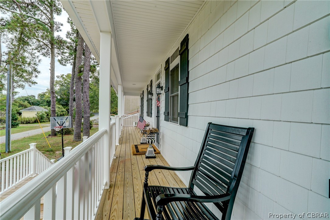 1237 Little Florida Road Farnham, VA 22460 - Photo 49 of 50 a view of balcony with wooden floor and outdoor seating