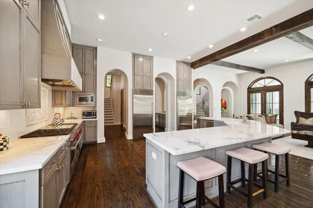a view of living room with granite countertop furniture and wooden floor