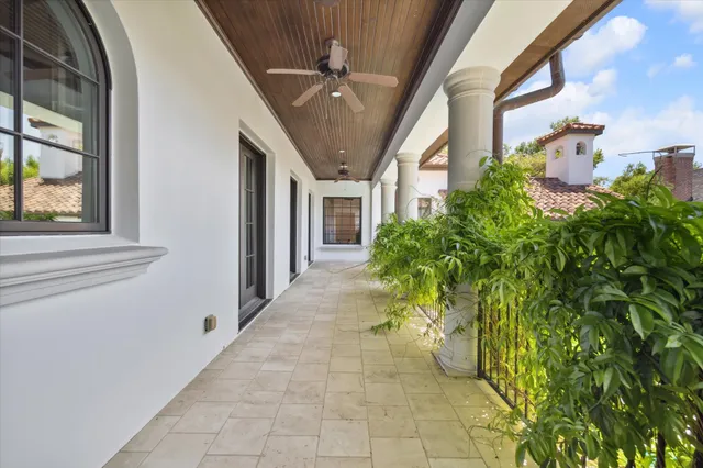 a entryway to room with potted plants