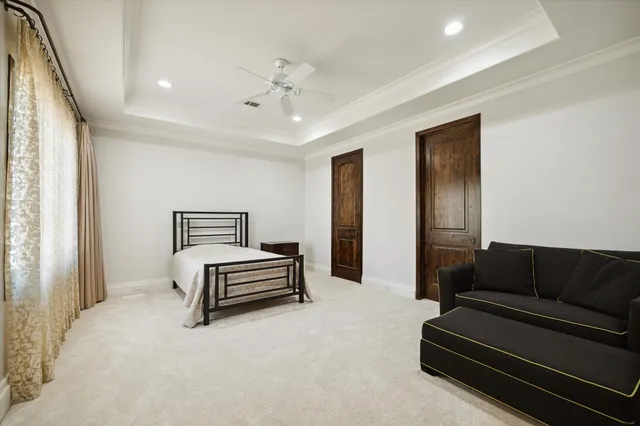 a bedroom with furniture and wooden floor