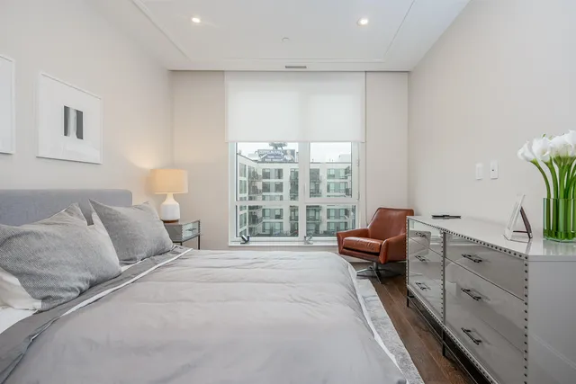 a bedroom with furniture and a window