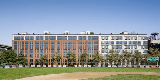 a view of a large building with a yard