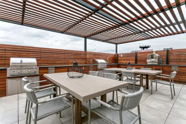 a patio with a table and chairs