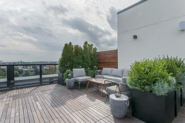 a view of a terrace with furniture