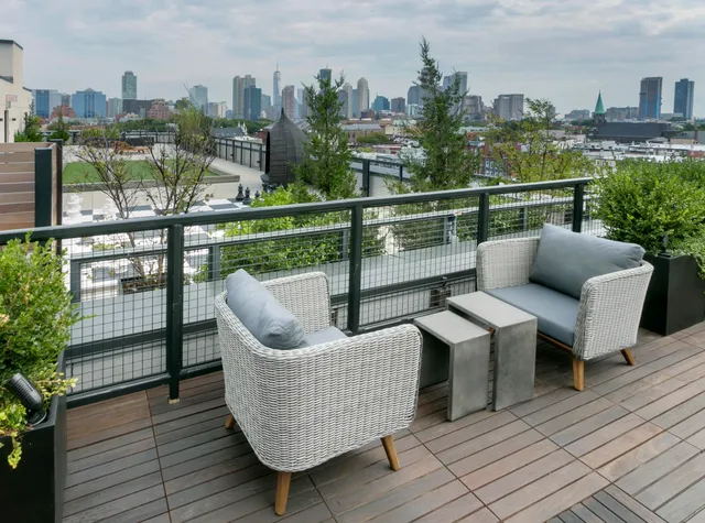 a view of a roof deck with couches