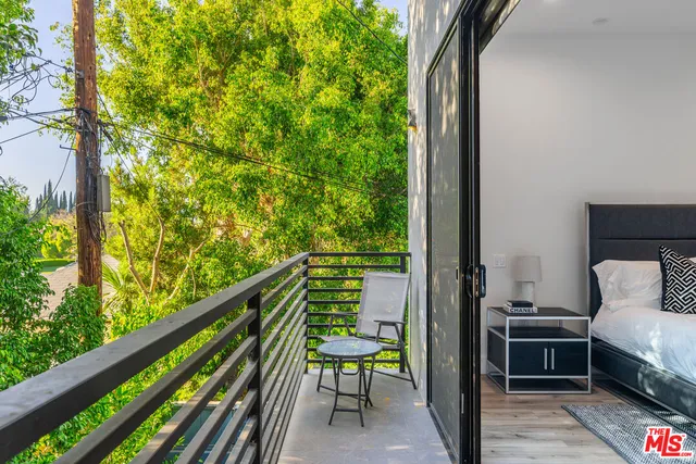 a view of balcony with furniture