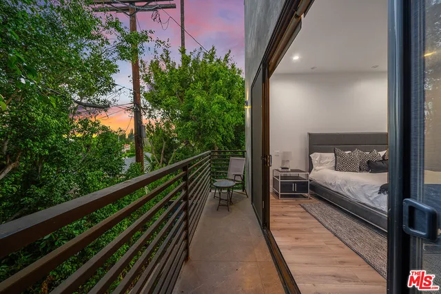 a view of a balcony with chairs