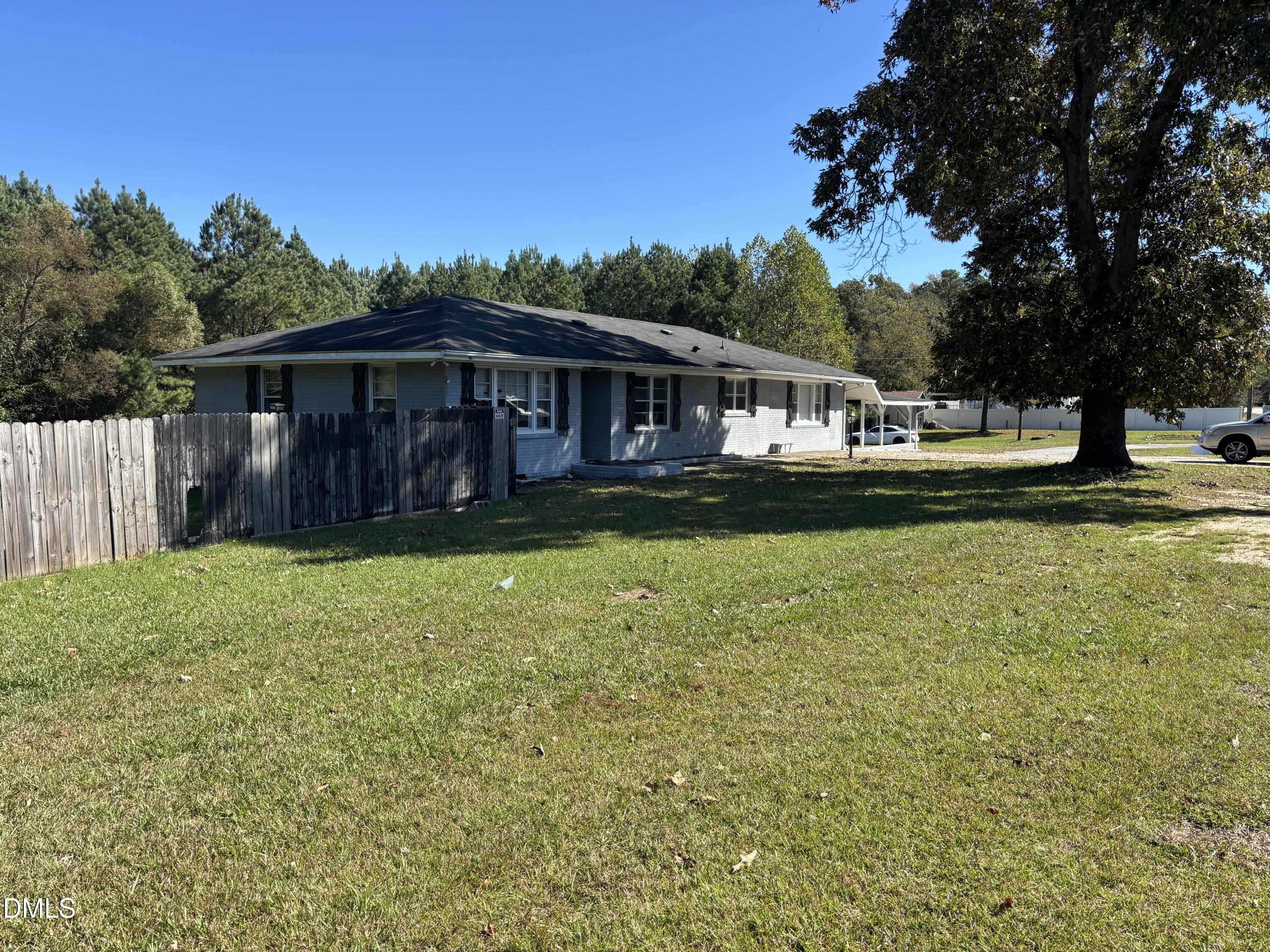 10666 Cleveland Road Garner, NC 27529 - Photo 2 of 8 a view of a house with a yard and sitting area