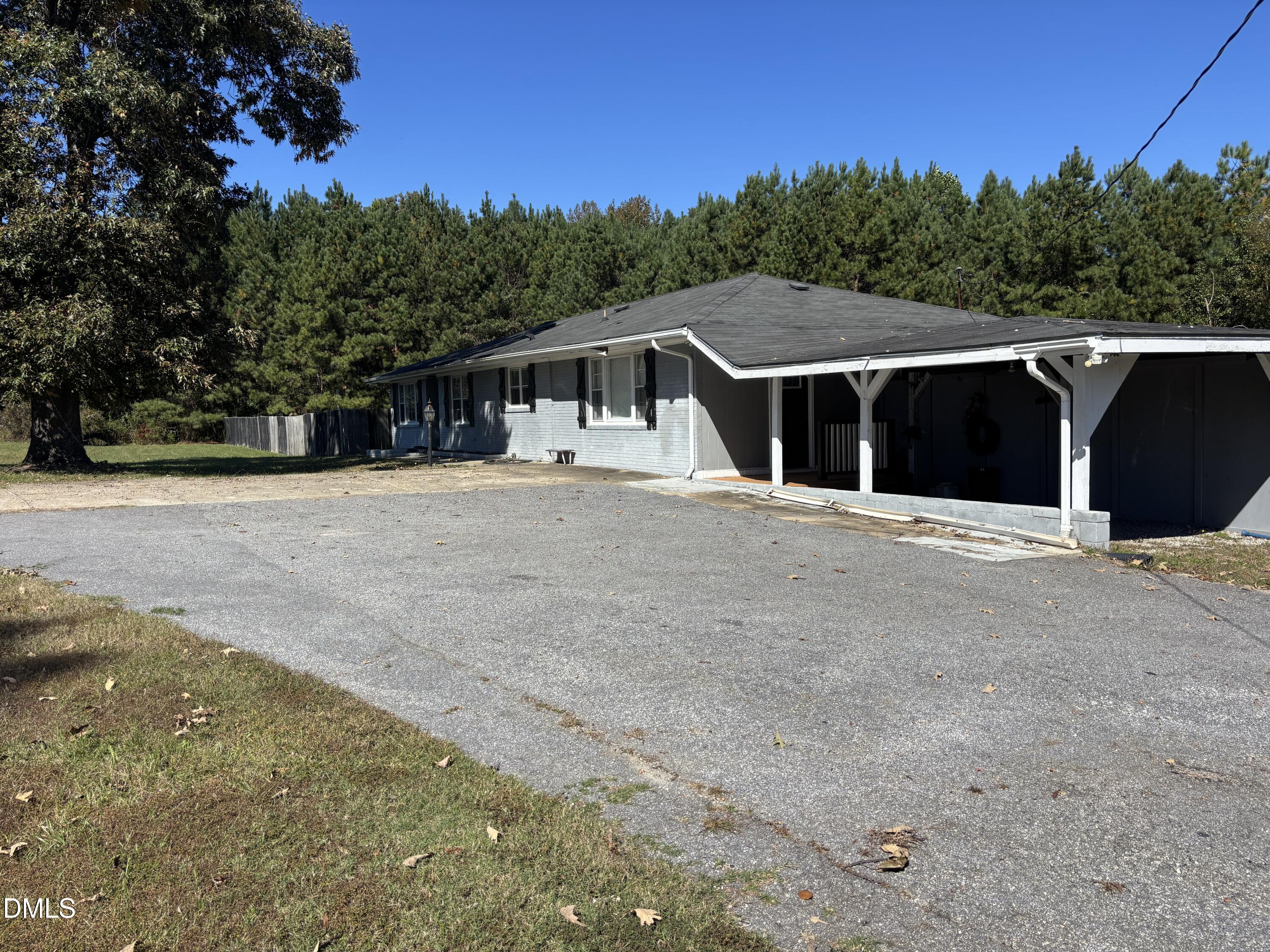 10666 Cleveland Road Garner, NC 27529 - Photo 3 of 8 a view of a barn in the middle of a yard