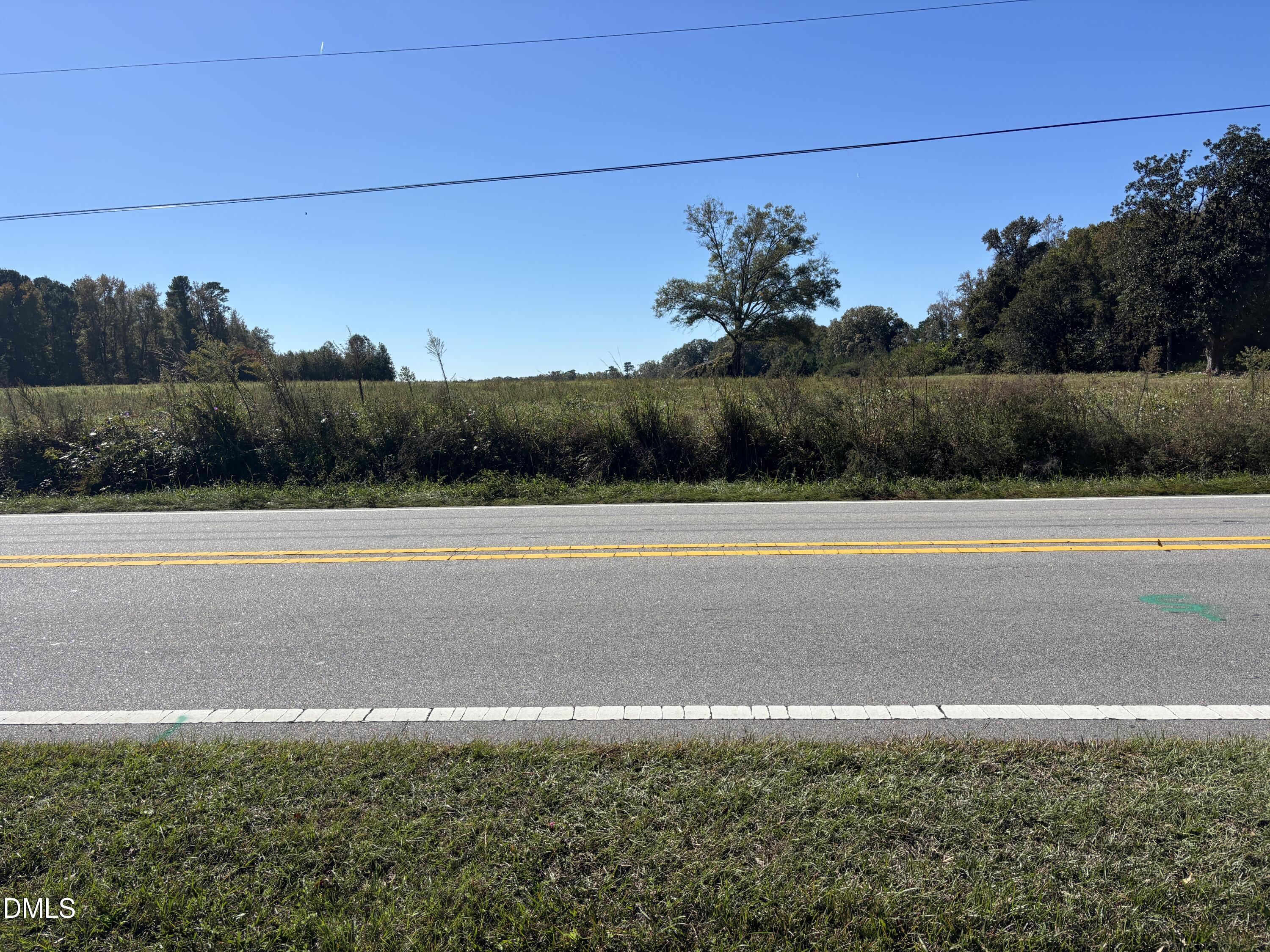 10666 Cleveland Road Garner, NC 27529 - Photo 6 of 8 a view of a swimming pool and a yard
