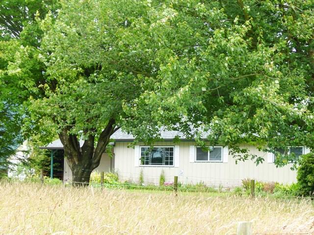 503 Hodgdon Road Tillamook, OR 97141 - Photo 17 of 43 a house with trees in the background
