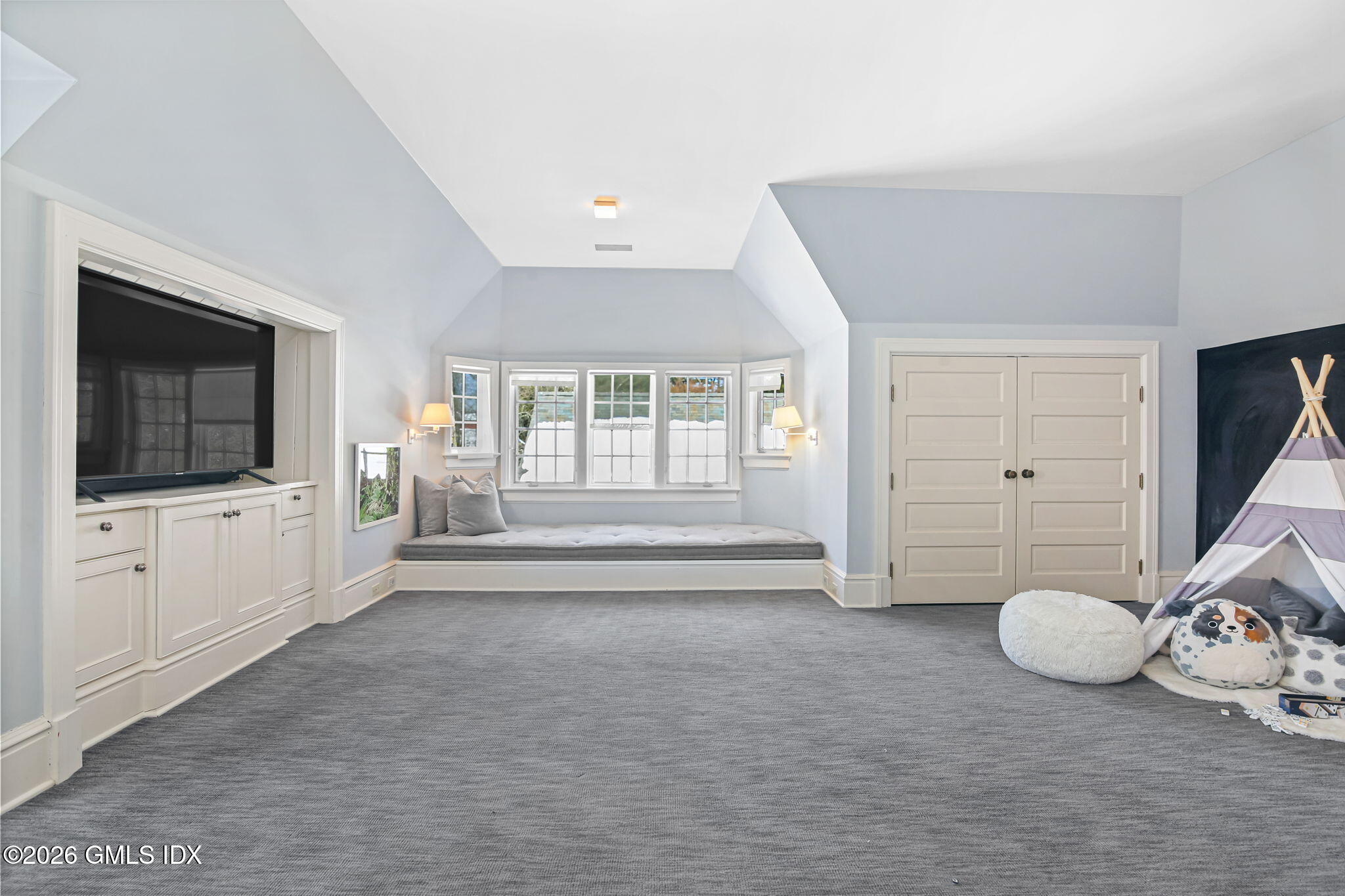 164 Round Hill Road Greenwich, CT 06831 - Photo 32 of 67 a view of a livingroom with an empty space and a flat screen tv