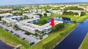 a view of a swimming pool with a yard