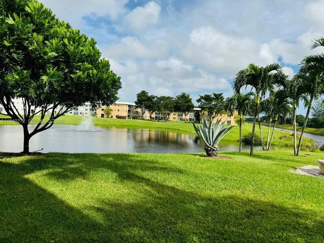 a view of a lake with houses in the back