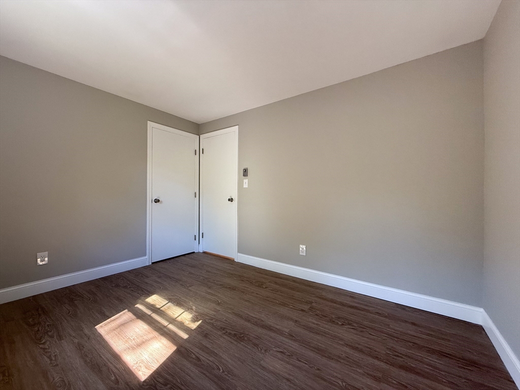 96 Richardson Road, Unit A22 Chelmsford, MA 01863 - Photo 13 of 22 a view of wooden floor and windows in a room
