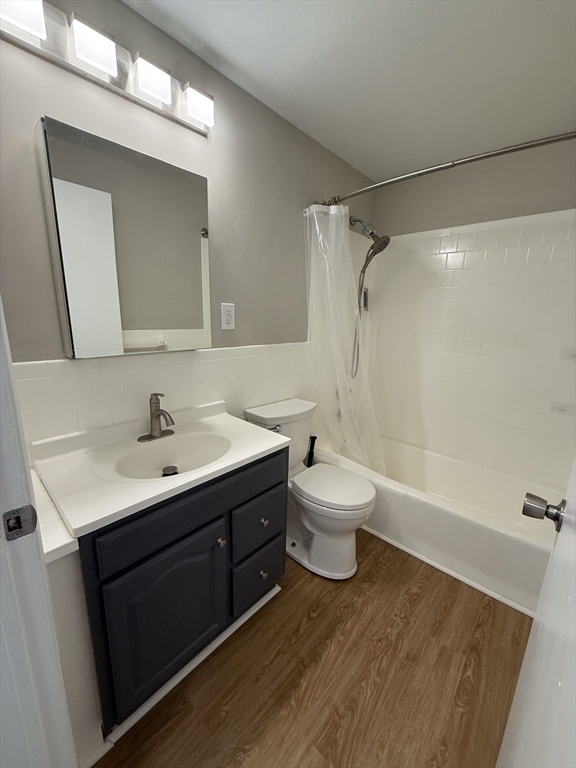 96 Richardson Road, Unit A22 Chelmsford, MA 01863 - Photo 16 of 22 a bathroom with a sink toilet a mirror and shower