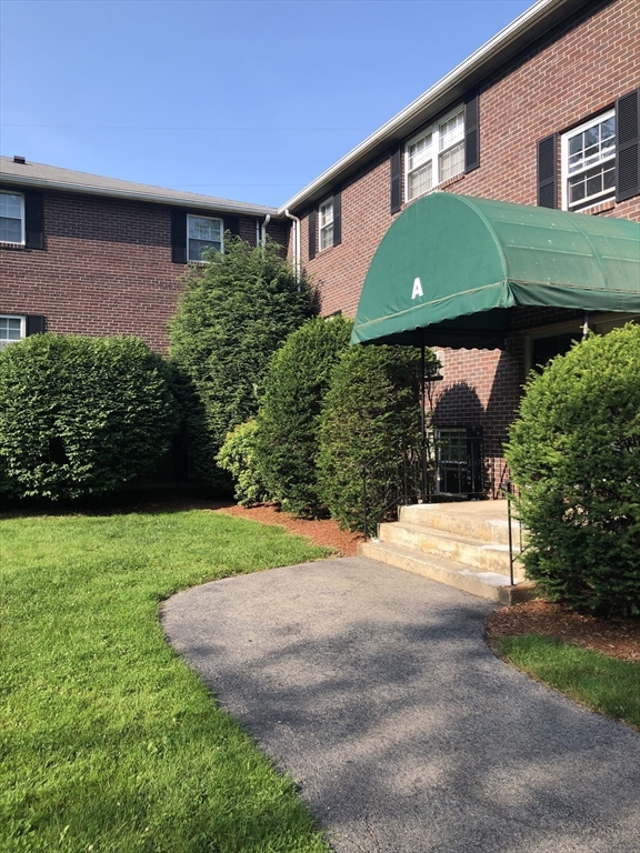 96 Richardson Road, Unit A22 Chelmsford, MA 01863 - Photo 17 of 22 a view of a back yard of the house