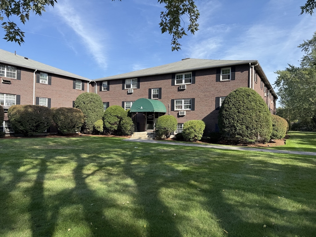 96 Richardson Road, Unit A22 Chelmsford, MA 01863 - Photo 18 of 22 a front view of a house with garden