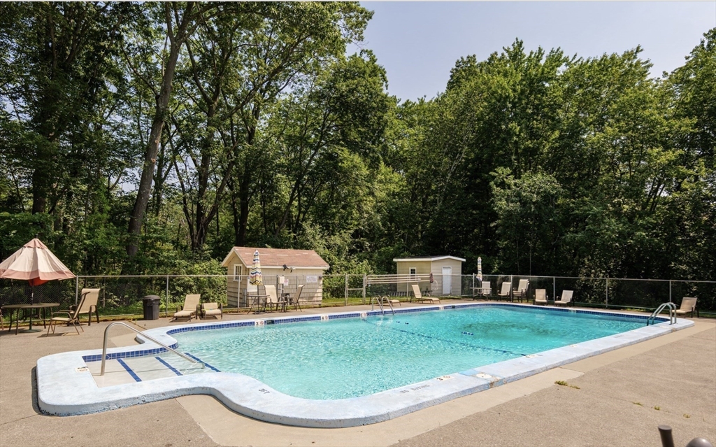 96 Richardson Road, Unit A22 Chelmsford, MA 01863 - Photo 19 of 22 a view of a swimming pool with a patio