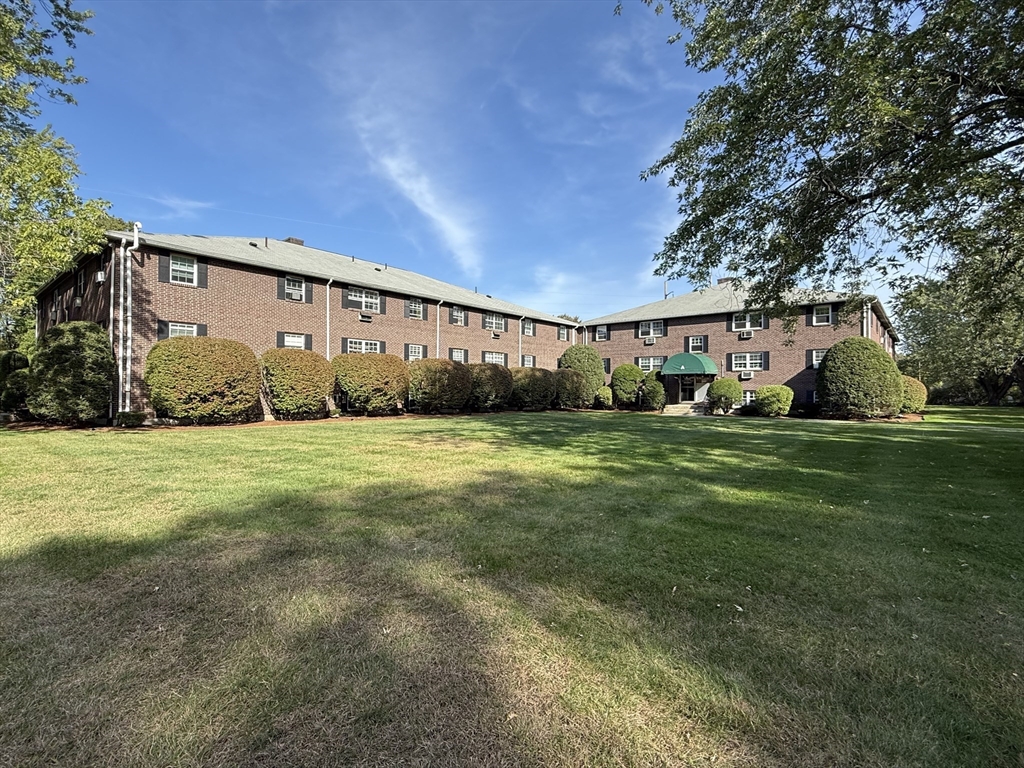 96 Richardson Road, Unit A22 Chelmsford, MA 01863 - Photo 20 of 22 a view of a house with backyard and trees