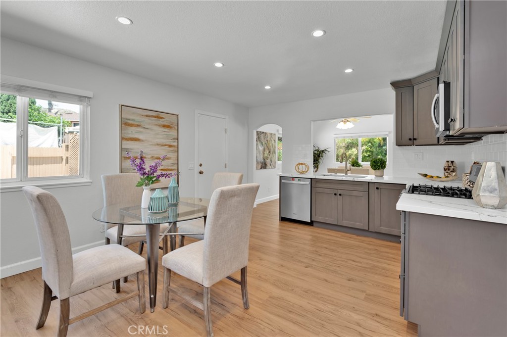 4829 East Kenyon Place Orange, CA 92869 - Photo 14 of 42 a view of kitchen with cabinets table and chairs