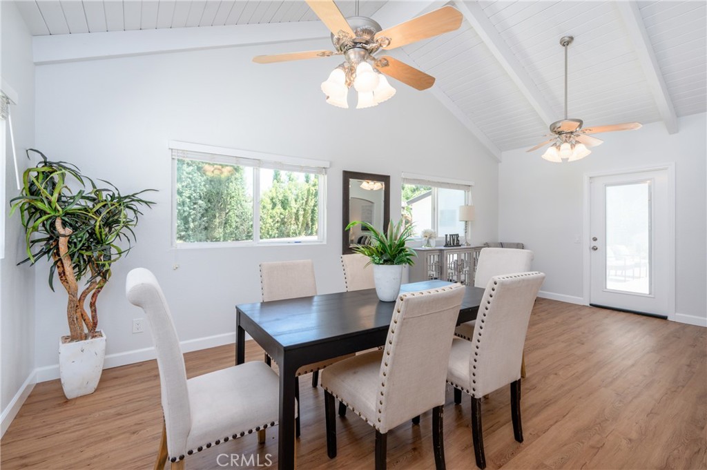 4829 East Kenyon Place Orange, CA 92869 - Photo 16 of 42 a view of a dining room with furniture window and wooden floor