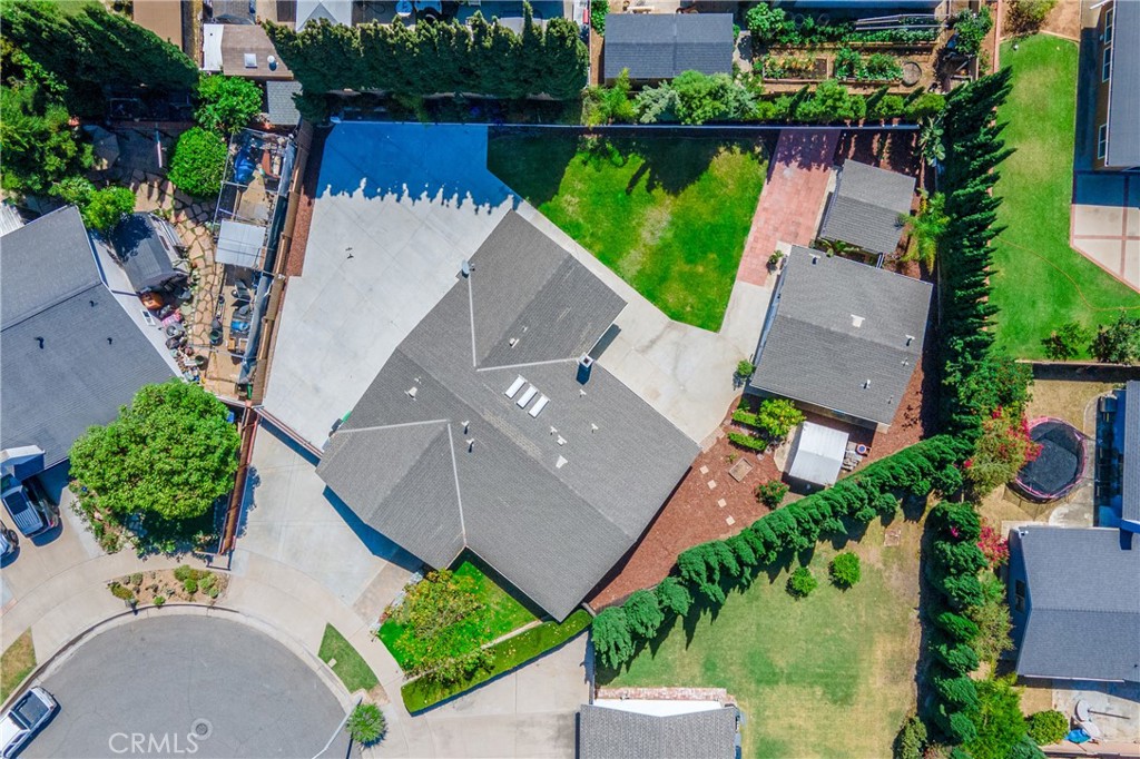 4829 East Kenyon Place Orange, CA 92869 - Photo 2 of 42 an aerial view of a house with a garden and lake view