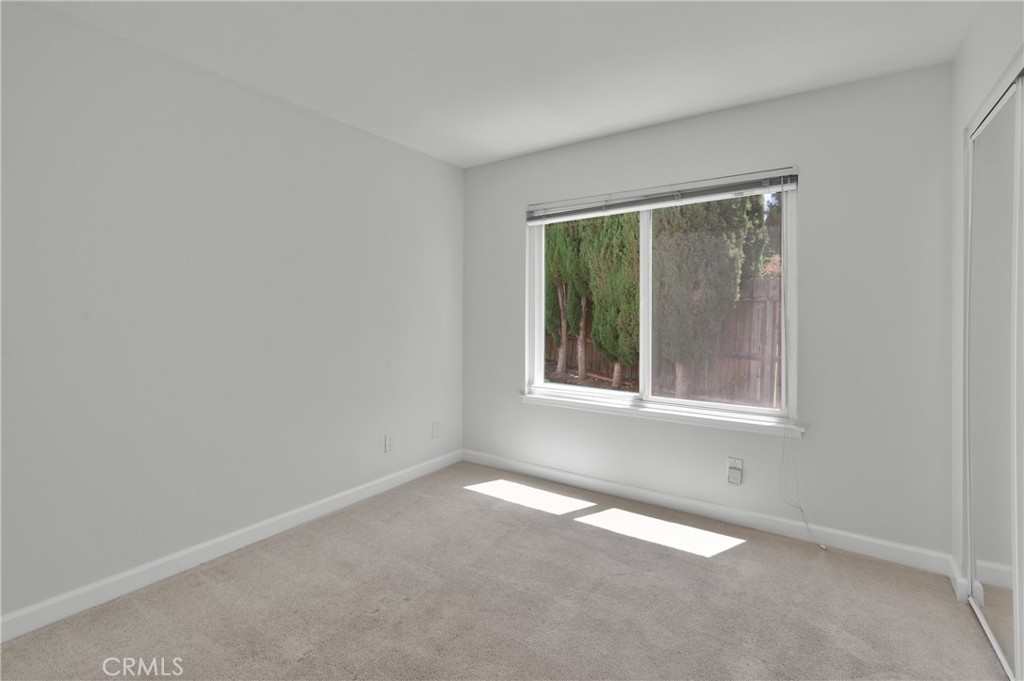 4829 East Kenyon Place Orange, CA 92869 - Photo 22 of 42 an empty room with a window