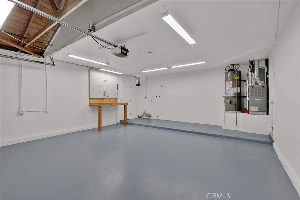 4829 East Kenyon Place Orange, CA 92869 - Photo 25 of 42 an empty room with ceiling fan and windows