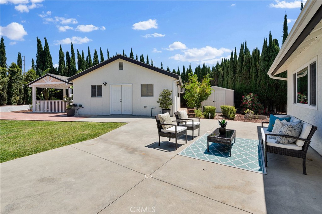 4829 East Kenyon Place Orange, CA 92869 - Photo 26 of 42 a view of a house with backyard and porch
