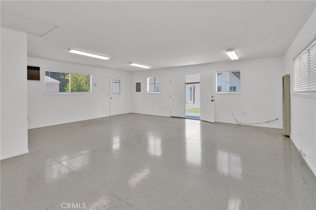 4829 East Kenyon Place Orange, CA 92869 - Photo 31 of 42 a view of a livingroom with wooden floor and window