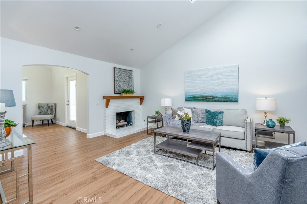 4829 East Kenyon Place Orange, CA 92869 - Photo 4 of 42 a living room with furniture and a fireplace