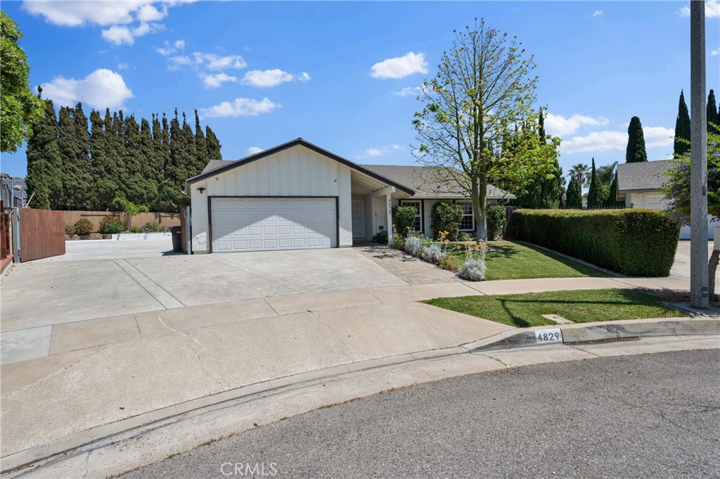 4829 East Kenyon Place Orange, CA 92869 - Photo 41 of 42 a view of backyard of house with green space