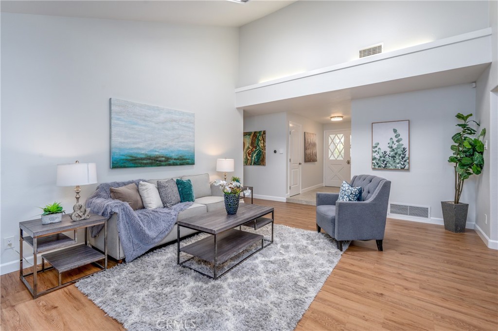 4829 East Kenyon Place Orange, CA 92869 - Photo 8 of 42 a living room with furniture and wooden floor