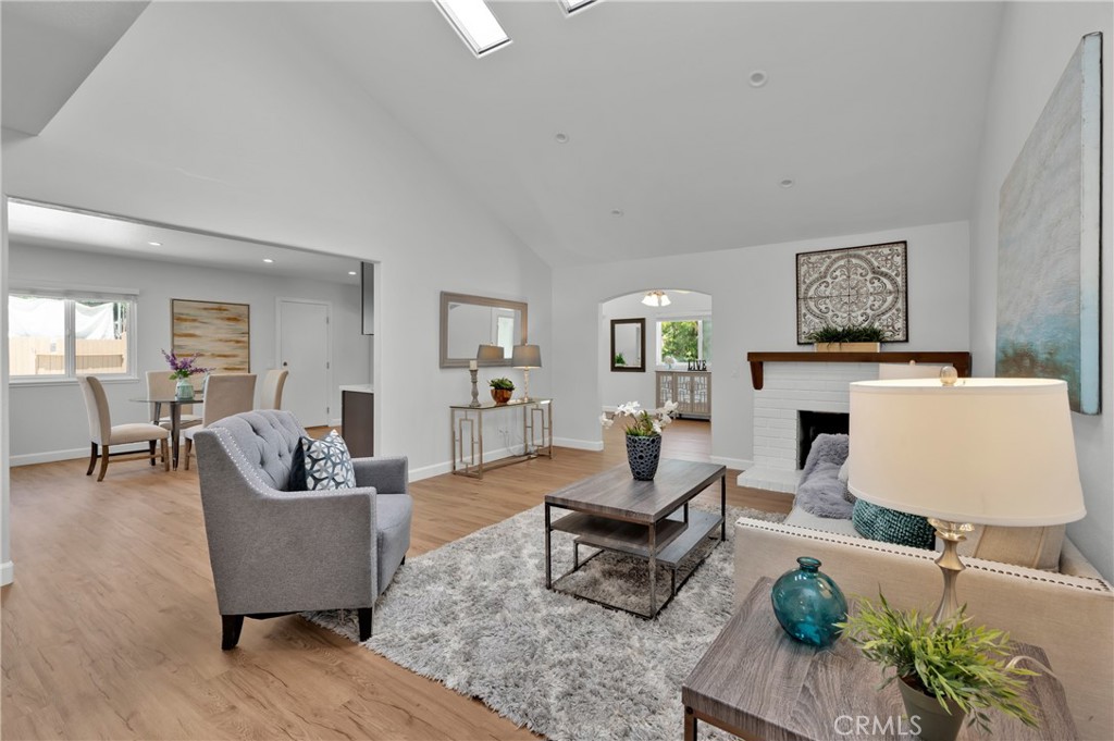 4829 East Kenyon Place Orange, CA 92869 - Photo 9 of 42 a living room with furniture and a wooden floor
