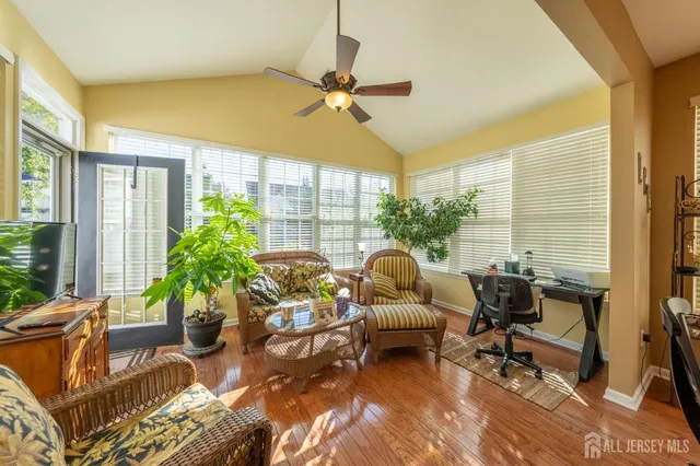 a living room filled with furniture and a large window