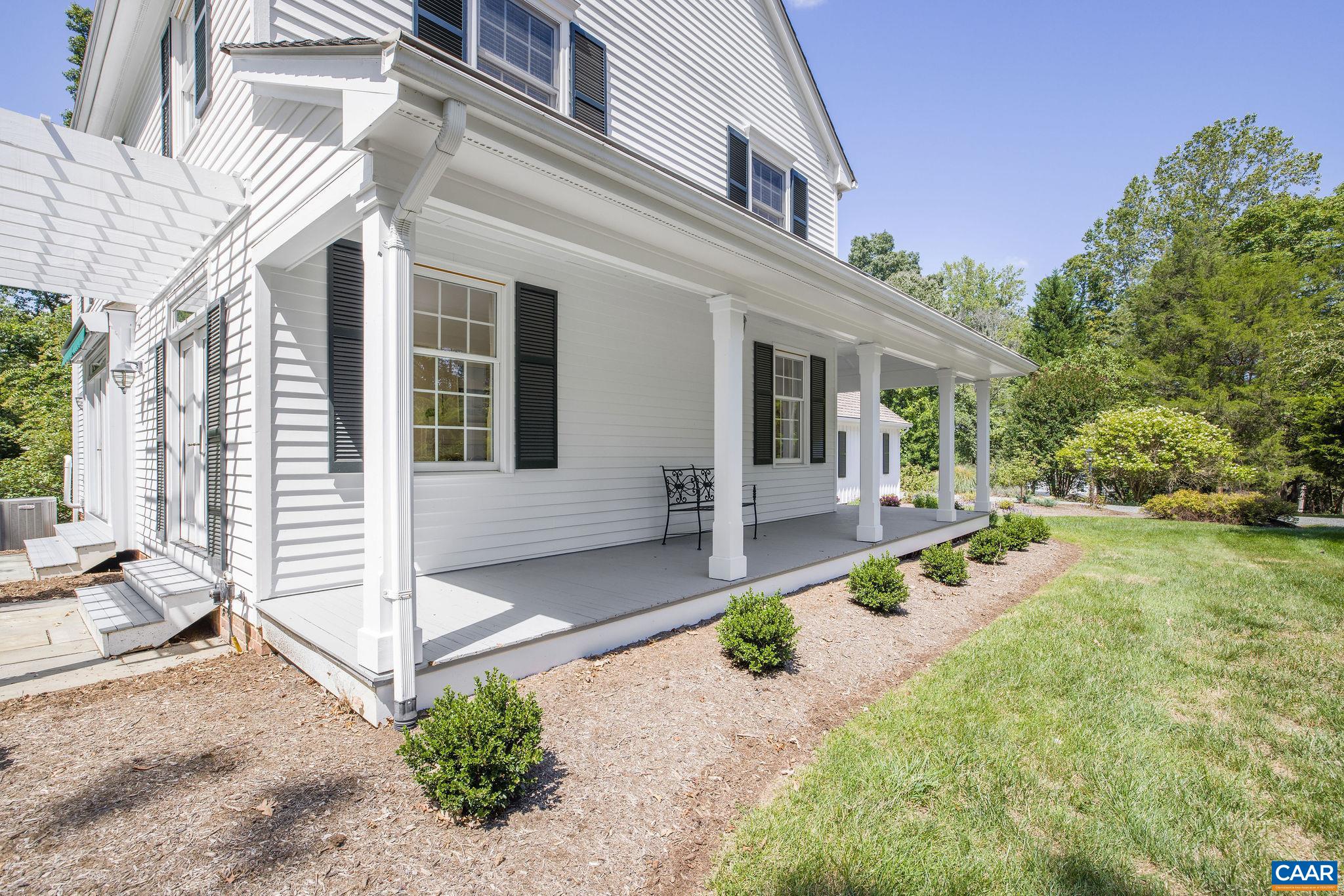 4470 Oldfields Road Free Union, VA 22940 - Photo 6 of 49 a front view of a house with a yard outdoor seating and a tree