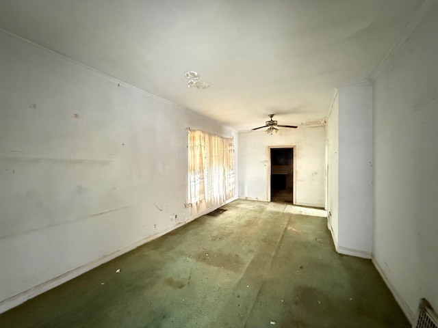 323 West 104th Place Chicago, IL 60628 - Photo 3 of 10 an empty room with windows and fireplace