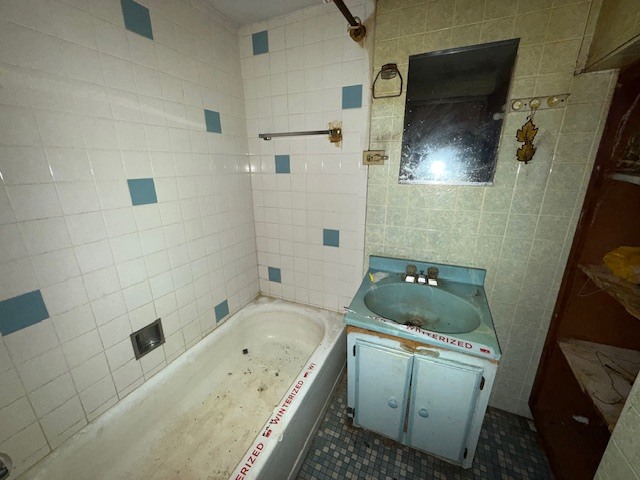 323 West 104th Place Chicago, IL 60628 - Photo 6 of 10 a bathroom with a granite countertop sink toilet and shower