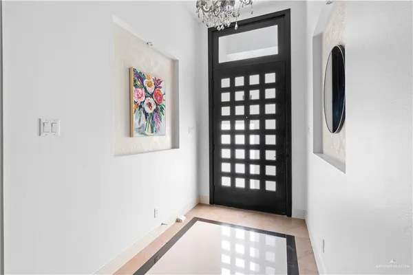 a view of an empty room with windows