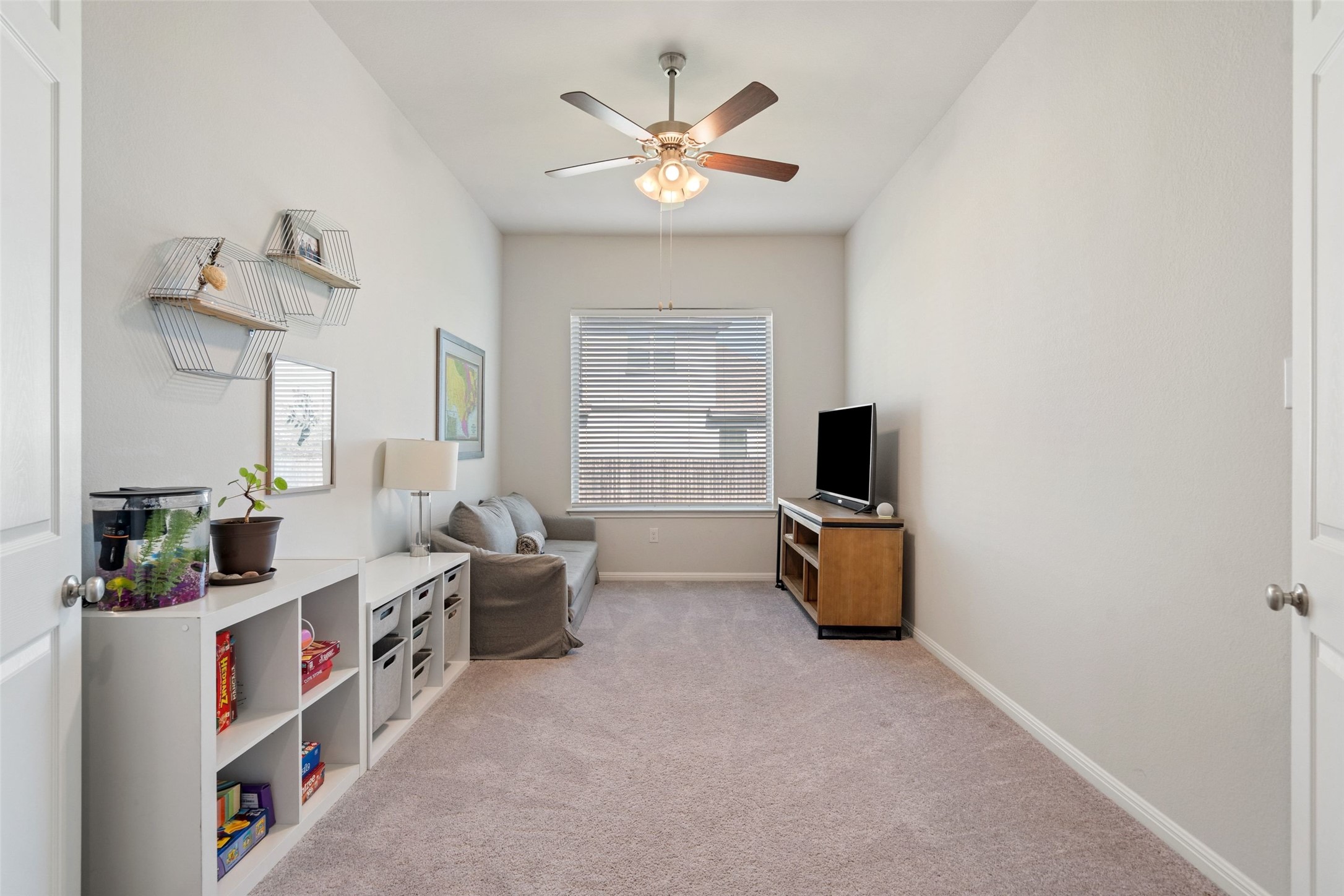 162 Lunar Loop Austin, TX 78737 - Photo 24 of 40 a living room with furniture and a flat screen tv
