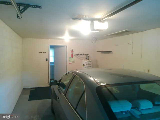 a room with a mirror and furniture