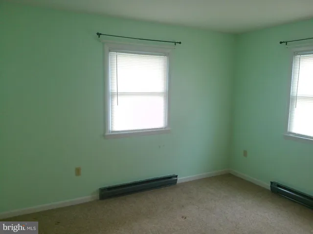 a bathroom with a toilet and a bathtub