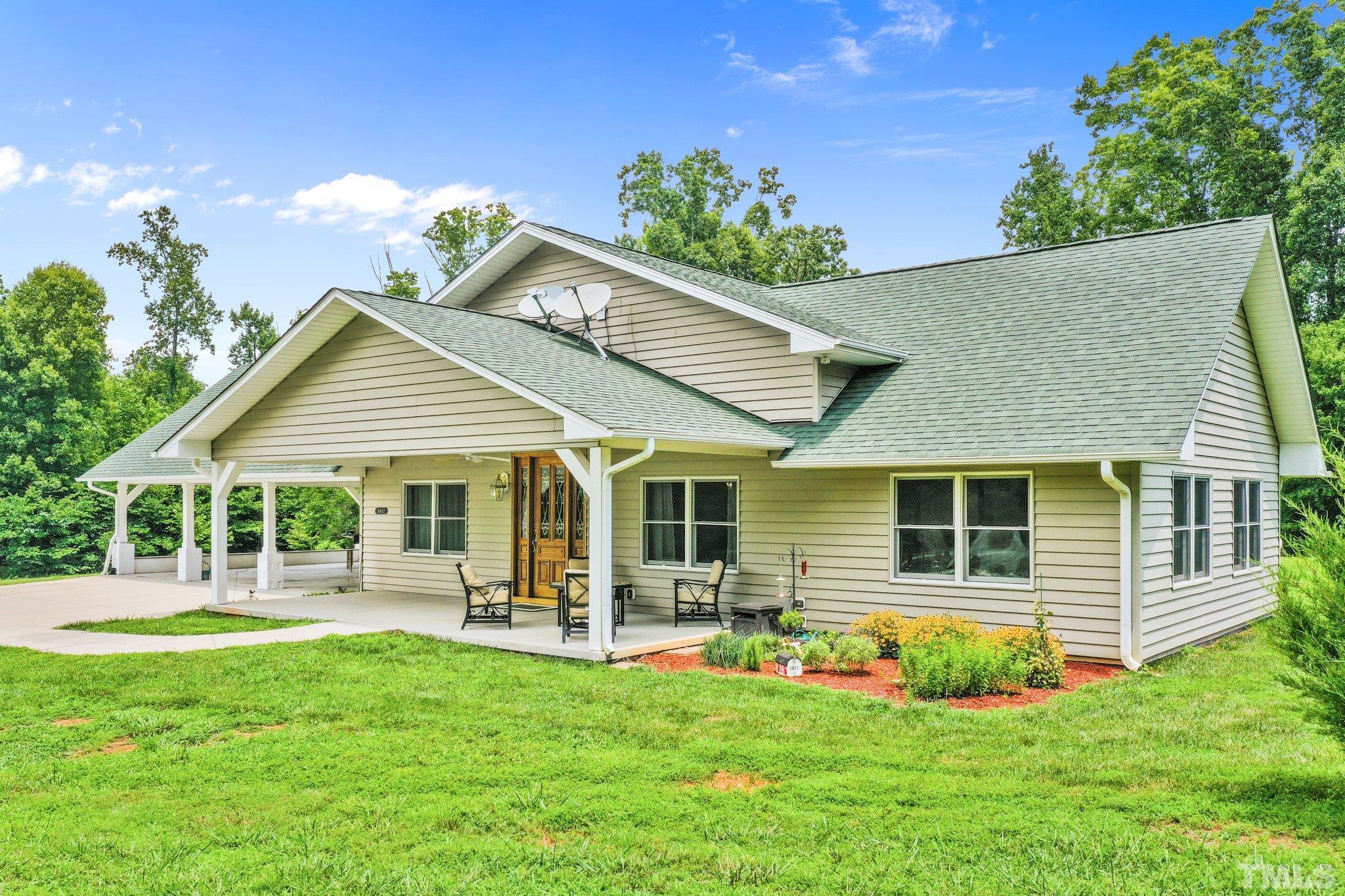 front view of a house with a yard