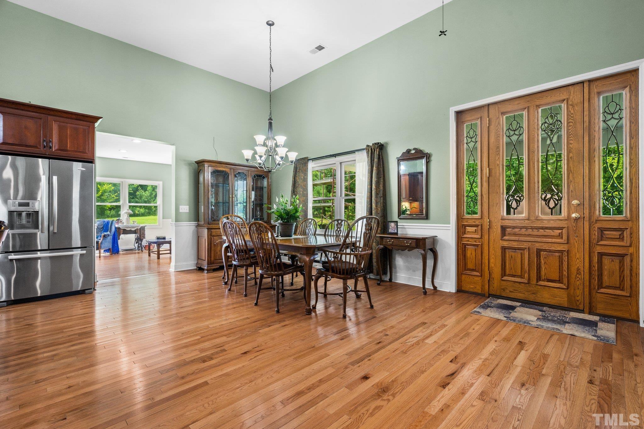 5012 Payton Drive Rougemont, NC 27572 - Photo 12 of 47 a view of a dining room with furniture window and wooden floor