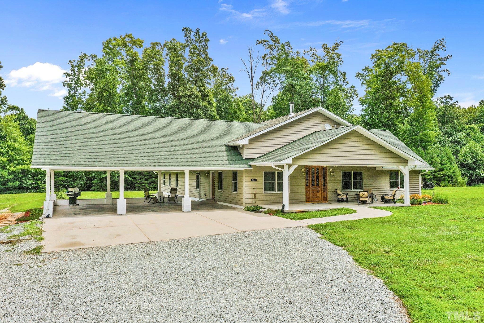 5012 Payton Drive Rougemont, NC 27572 - Photo 2 of 47 front view of a house with a yard