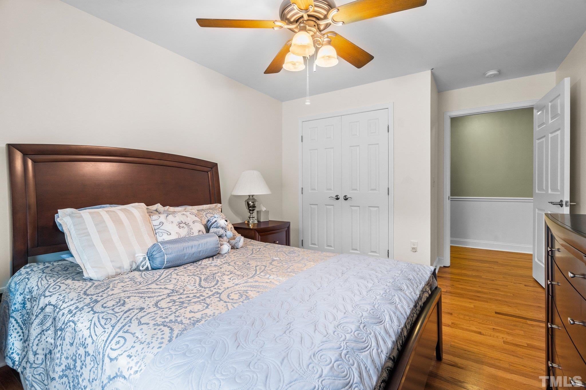 5012 Payton Drive Rougemont, NC 27572 - Photo 23 of 47 a bedroom with a bed and a chandelier