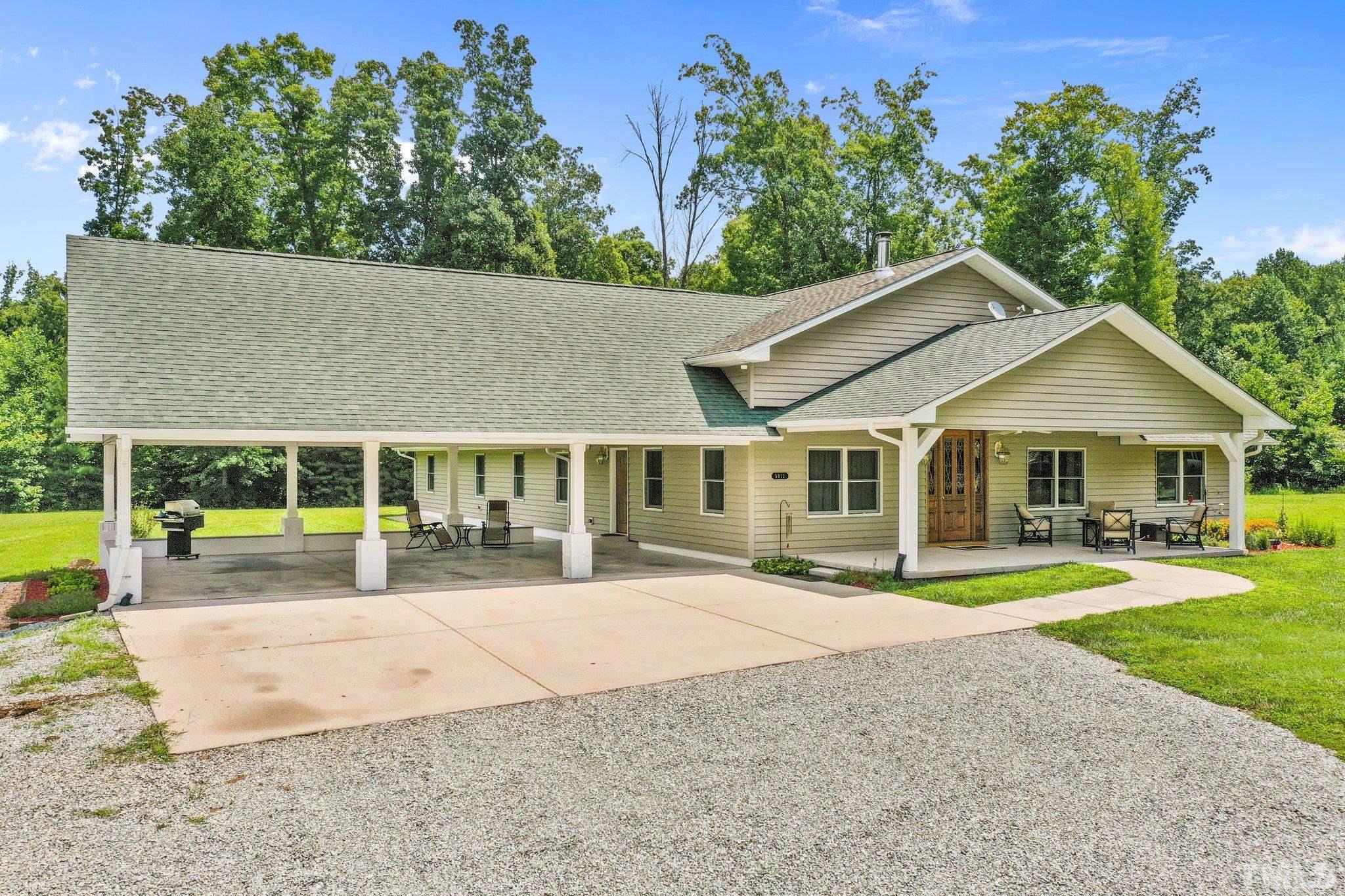 5012 Payton Drive Rougemont, NC 27572 - Photo 31 of 47 front view of a house with a yard